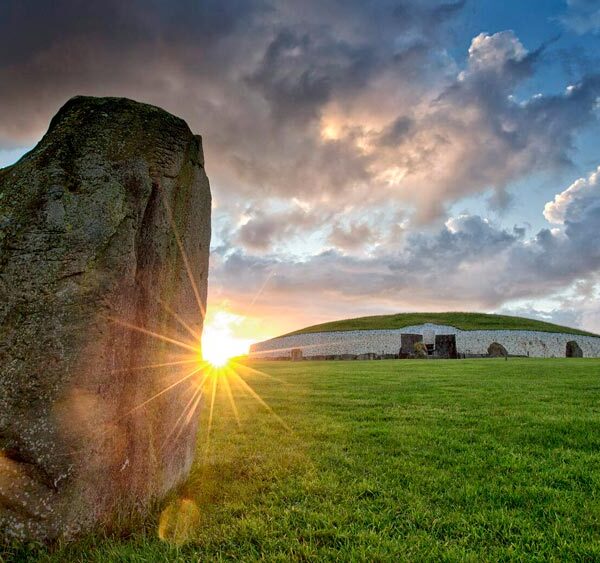 Large rock in the foreground, with Historical site in the background.