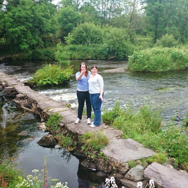 Two people on small bridge