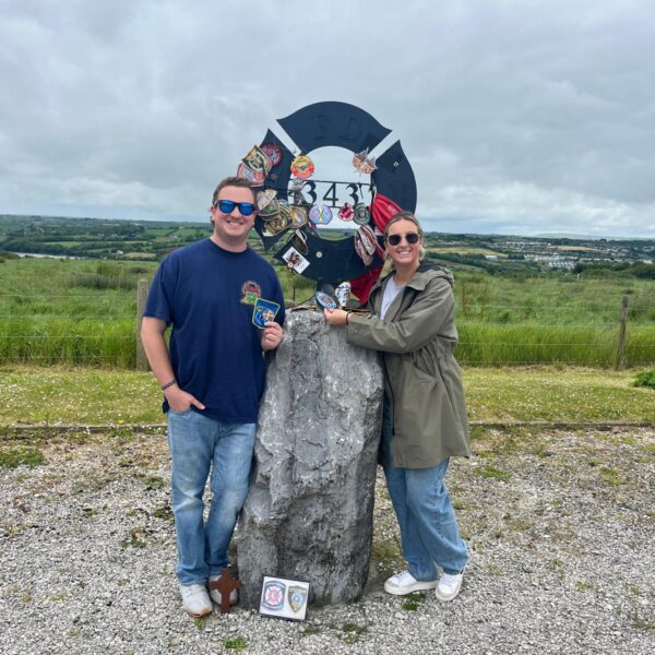 Couple beside a monument in the Memorial Garden, Kinsale, Co. Cork.
